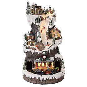Pueblo navideño 30x20x20 cm con luces y tren en movimiento