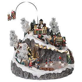 Christmas village reindeer sleigh ice skaters movement lights music s4