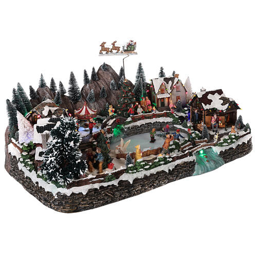 Weihnachtsdorf mit Schlittschuhläufern und weißem See beleuchtet, 35x65x40 cm 4