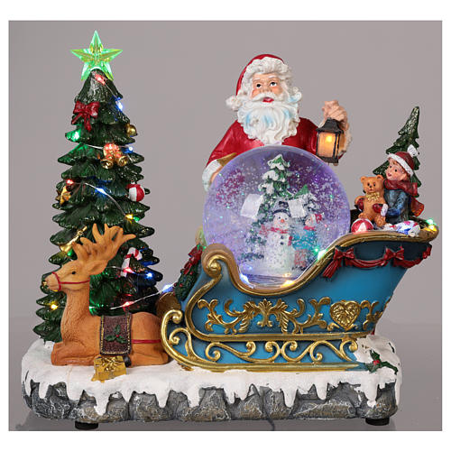 Weihnachtsmann Schlitte mit Schneekugel 25x30x20cm Licht und Musik 2