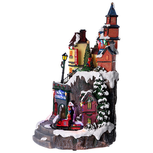 Weihnachtsdorf mit Spielzeugladen beleuchtet mit Musik, 35x20x20 cm 3