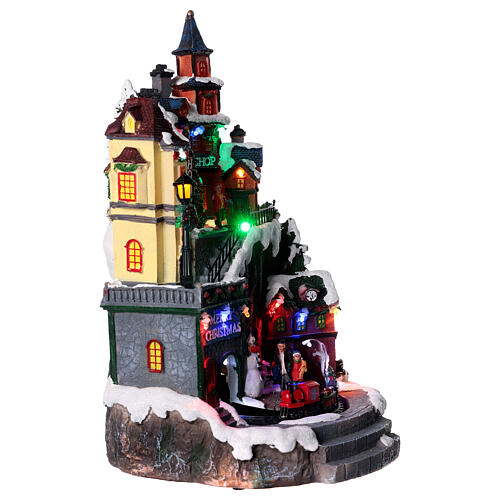 Weihnachtsdorf mit Spielzeugladen beleuchtet mit Musik, 35x20x20 cm 4