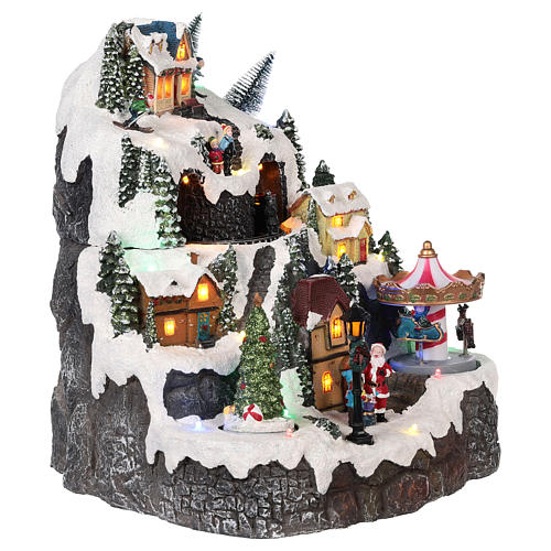 Christmas village with mountain snow carousel motion lights music 30x25x15 cm 4