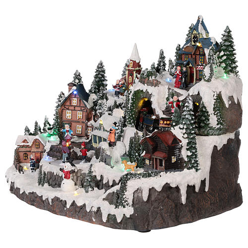Christmas village with moving elements, lights and music 40x30x30 cm 3