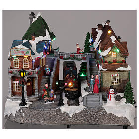 Christmas village train station with moving elements, lights and music 25x35x25 cm s2