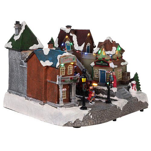 Christmas village with animated train station lights music 25x35x25 4
