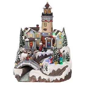 Village Noël avec phare mouvement lumières musique 35x25x25 cm