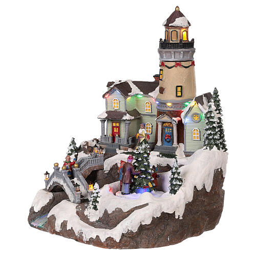 Christmas village with lighthouse movement lights music 35x25x25 cm 3
