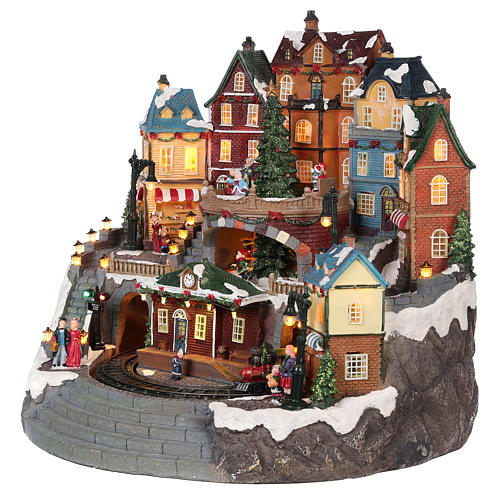 Christmas village with moving elements, lights and music 40x40x35 cm 3