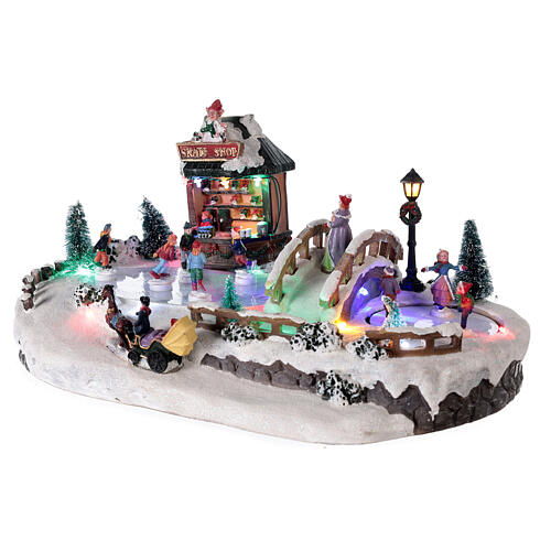 Christmas village with ice rink and shop, 25x20x40 cm 3