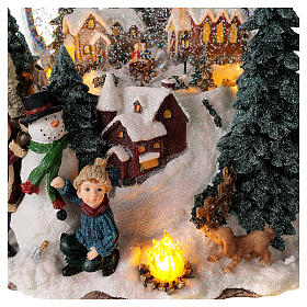 Spieluhr als Schneekugel mit Winterlandschaft und Lichtern, 25x20x25 cm