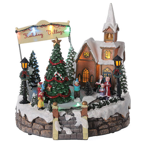 Aldeia de Natal em miniatura iluminada com igreja, coral, árvore de Natal, patinadores e música 19,5x24x24 cm 1