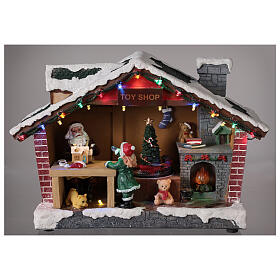 Miasteczko Bożonarodzeniowe domek Świętego Mikołaja światełka melodia 25x35x15 cm