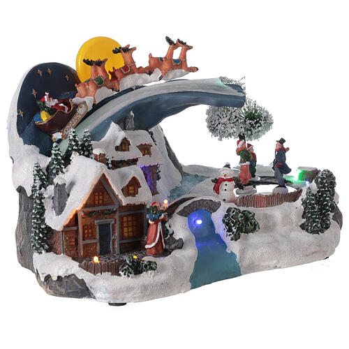 Cenário de Natal em miniatura aldeia nevada com Pai Natal no trenó e lua cheia, luzes LEd e música, 20x35,5x21,5 cm 4