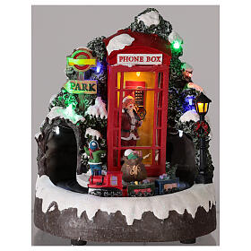 Cenário natalino em miniatura cabina telefónica Pai Natal comboio, luzes e música, 22x19x18 cm