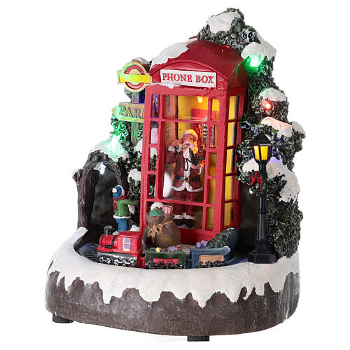 Cenário natalino em miniatura cabina telefónica Pai Natal comboio, luzes e música, 22x19x18 cm 3