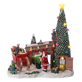 Village Noël atelier cadeaux Père Noël lumières musique 30x30x15 cm
