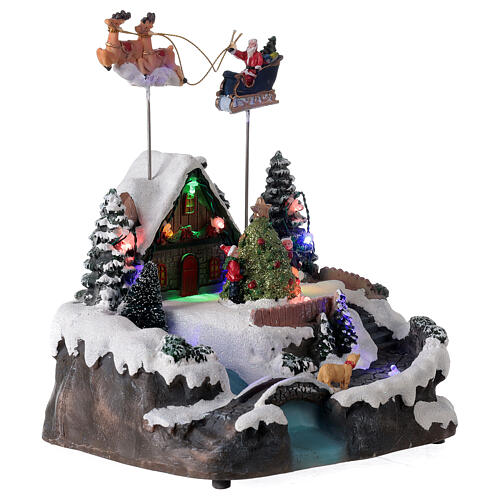 Aldeia de Natal em miniatura com riacho e o Pai Natal no trenó, luzes e música, 24x21x20 cm 4