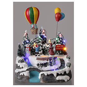 Aldeia de Natal em miniatura com crianças e balão de ar quente, luzes e música, 24x21x20 cm