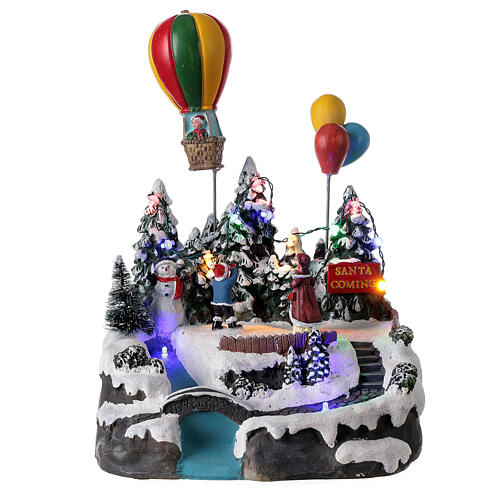 Aldeia de Natal em miniatura com crianças e balão de ar quente, luzes e música, 24x21x20 cm 1