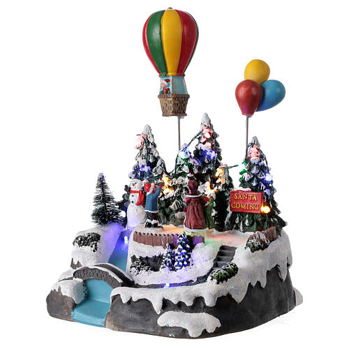 Aldeia de Natal em miniatura com crianças e balão de ar quente, luzes e música, 24x21x20 cm 3