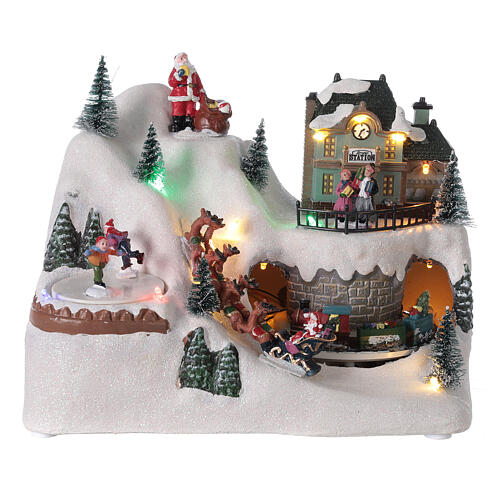 Cenário natalino em miniatura aldeia com Pai Natal no trenó, comboio e pista de gelo, luzes LED e música, 20x26x17 cm 1