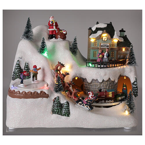 Cenário natalino em miniatura aldeia com Pai Natal no trenó, comboio e pista de gelo, luzes LED e música, 20x26x17 cm 2