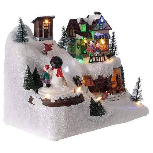 Village Noël skieurs mouvement musique lumières LED 20x25x15 cm 4