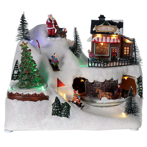 Cenário natalino em miniatura aldeia com crianòas brincando, boneco de neve e luzes LED e música, 20x26x17 cm 1