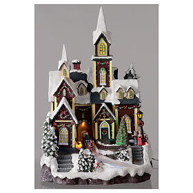 Iglesia nórdica nevada pueblo Navidad luces música 45x30x25 cm