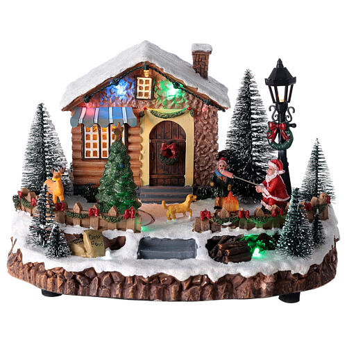 Pueblo navideño Papá Noel y hoguera luces música 25x15x20 cm 1