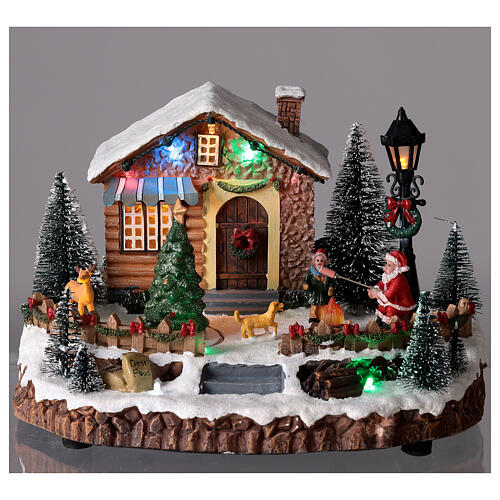 Pueblo navideño Papá Noel y hoguera luces música 25x15x20 cm 2