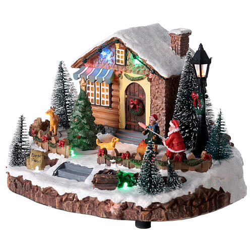 Pueblo navideño Papá Noel y hoguera luces música 25x15x20 cm 3