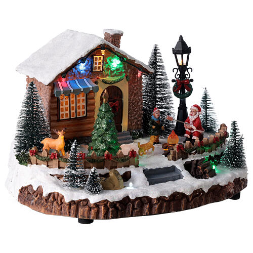 Christmas village Santa Claus and bonfire lights and music 25x15x20 cm 4