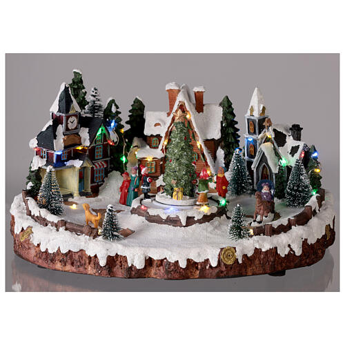 Villaggio natalizio albero di Natale e bambini luci e musica 30x15x30 cm 2