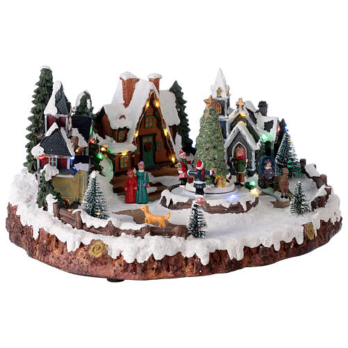 Villaggio natalizio albero di Natale e bambini luci e musica 30x15x30 cm 4