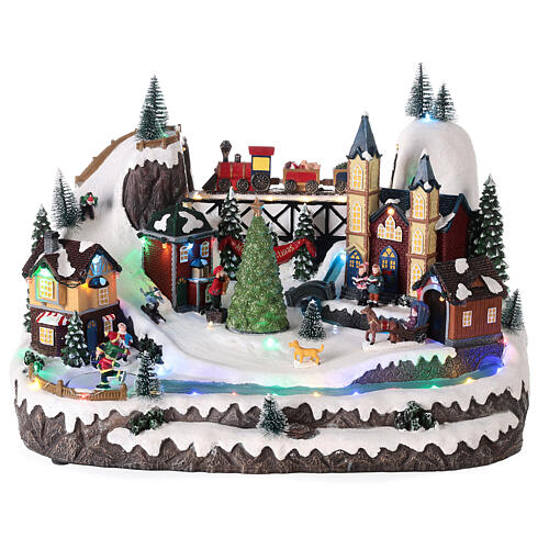 Christmas village 20x35x25 cm animated Christmas tree and skaters, batteries or electricity 1
