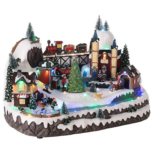 Christmas village 20x35x25 cm animated Christmas tree and skaters, batteries or electricity 4