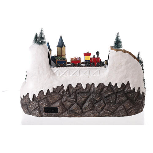 Christmas village 20x35x25 cm animated Christmas tree and skaters, batteries or electricity 5