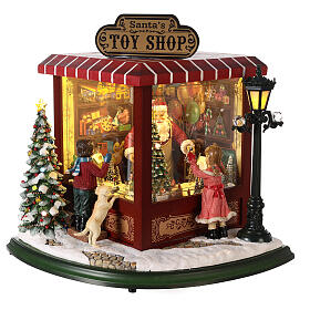 Cenário natalino em miniatura loja de brinquedos Pai Natal pilhas e corrente 37x33x33 cm
