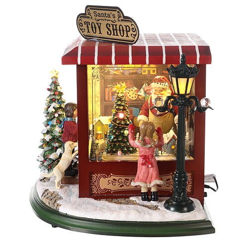Cenário natalino em miniatura loja de brinquedos Pai Natal pilhas e corrente 37x33x33 cm 4