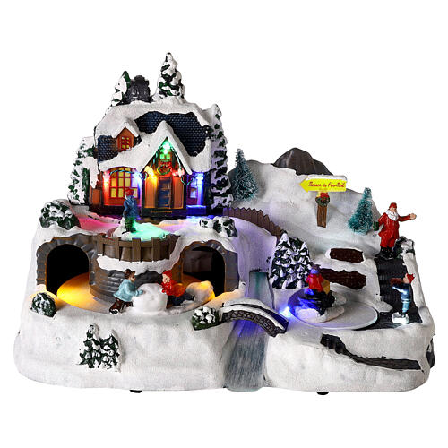 Christmas village with children in motion, LED lights, 25x35x20 cm 1
