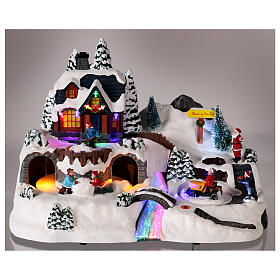 LED Christmas village with moving children 25x35x20 cm