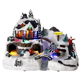 LED Christmas village with moving children 25x35x20 cm