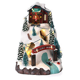 Christmas village, mountain with skiers, animation and LED light, 20x15x25 cm