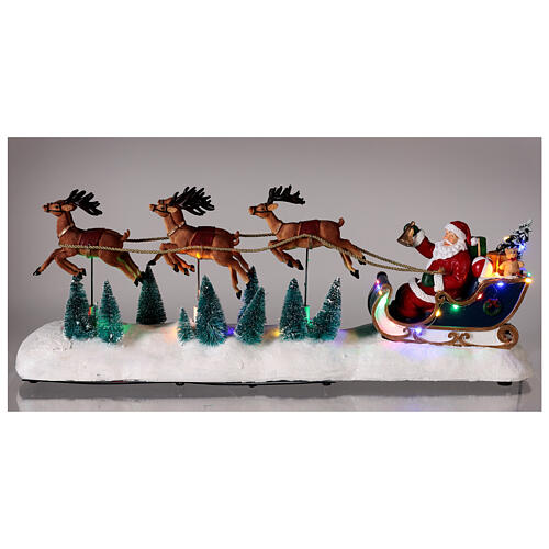 Snowy Santa's sleigh with reindeers in motion, LED lights, 25x60x15 cm 2