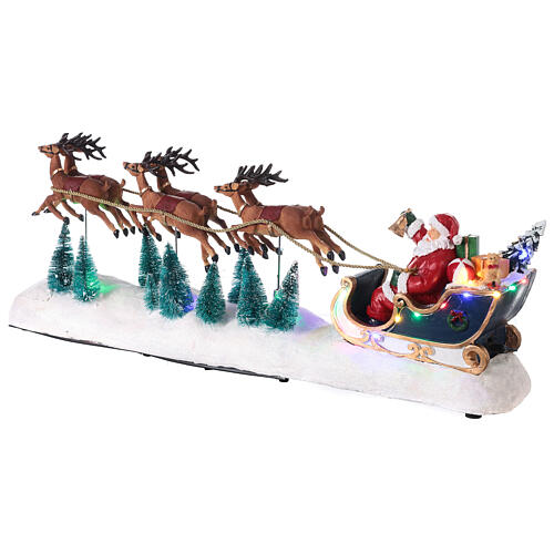 Snowy Santa's sleigh with reindeers in motion, LED lights, 25x60x15 cm 4