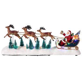 Miasteczko bożonarodzeniowe, sanie Świętego Mikołaja, śnieg, renifery, ruch, oświetlenie LED, 25 x 60 x 15 cm