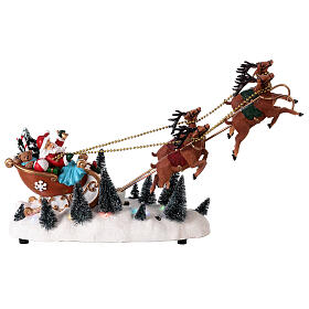 Snowy Santa's sleigh with flying reindeers, LED lights, 35x45x15 cm