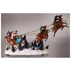 Snowy Santa's sleigh with flying reindeers, LED lights, 35x45x15 cm